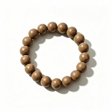 A handmade prayer bead bracelet made from natural, aromatic herbal beads; a unisex scented accessory for meditation and everyday wear