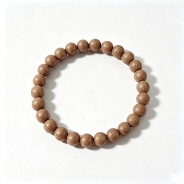 A handmade prayer bead bracelet made from natural, aromatic herbal beads; a unisex scented accessory for meditation and everyday wear